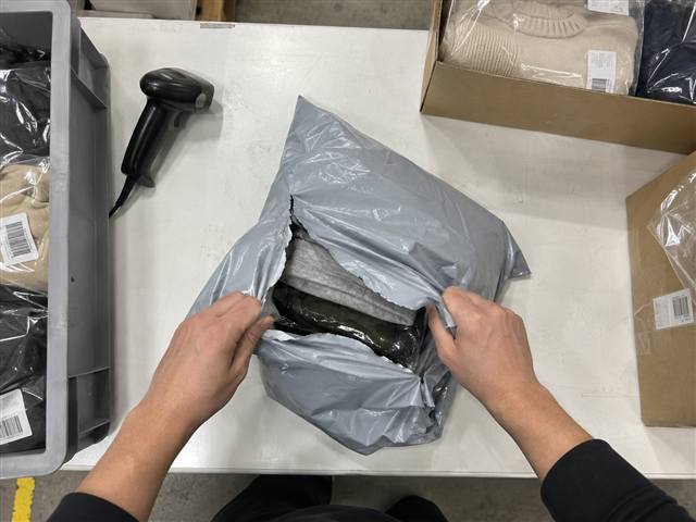 A returned parcel being opened at the bench